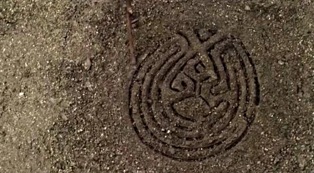 Screenshot from HBO's West World TV show featuring a maze-like symbol called The Maze in the show.