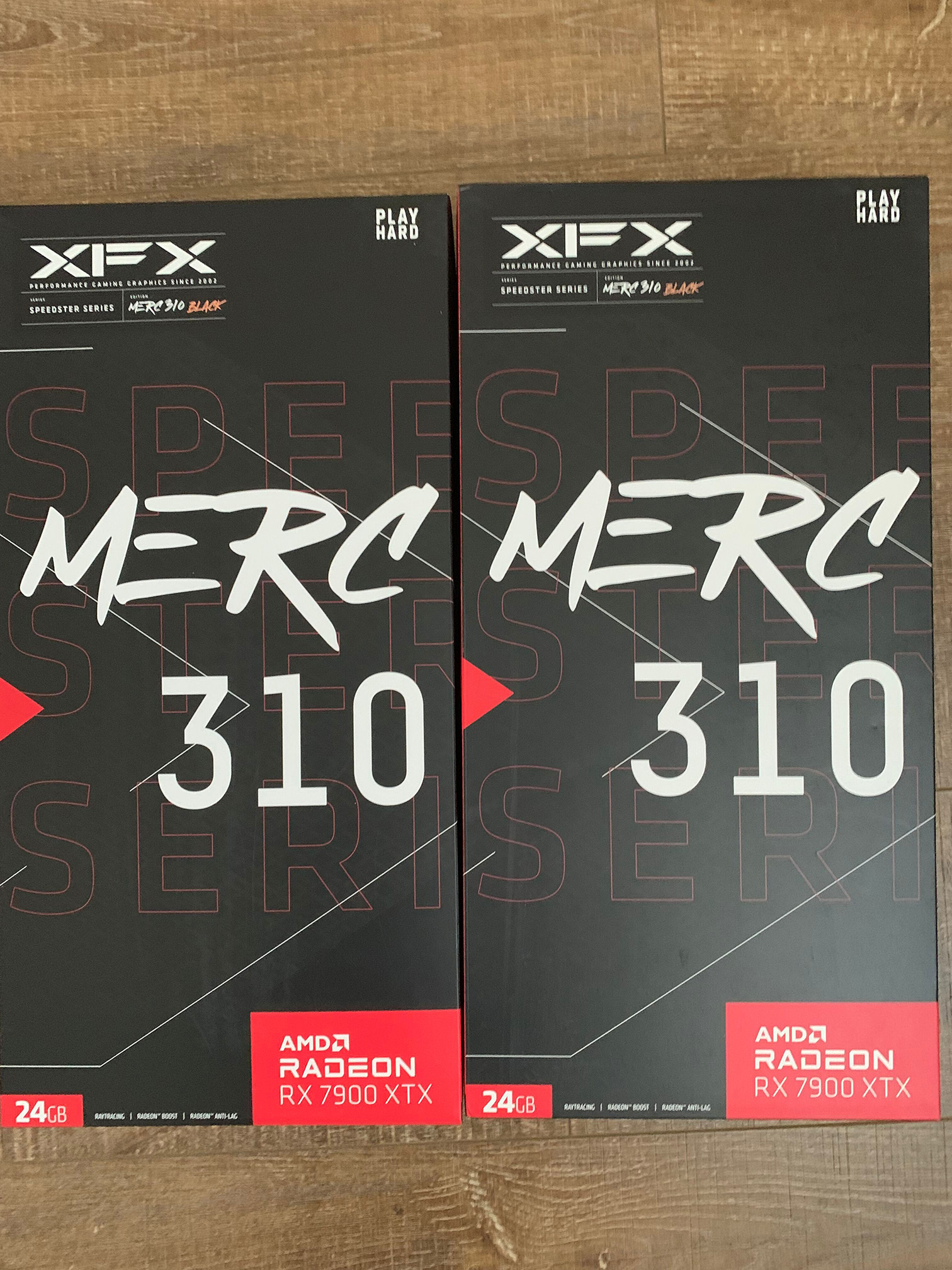 Two boxes of XFX AMD Radeon RX 7900XTX GPUs